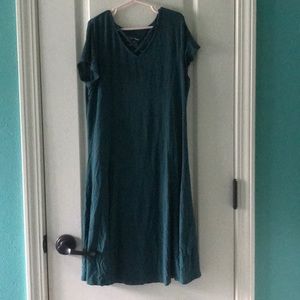 A blue dress with a cross in front